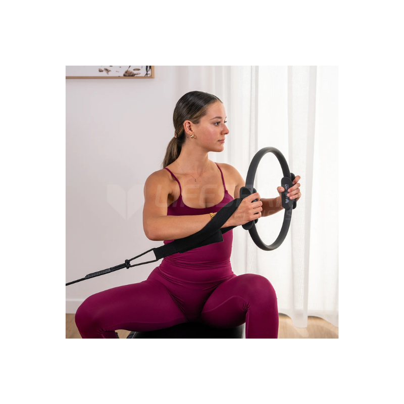 Lady with pilates ring workout