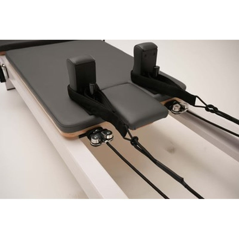 core-collab-queen-studio-reformer-shoulder-block-carriage-closeup